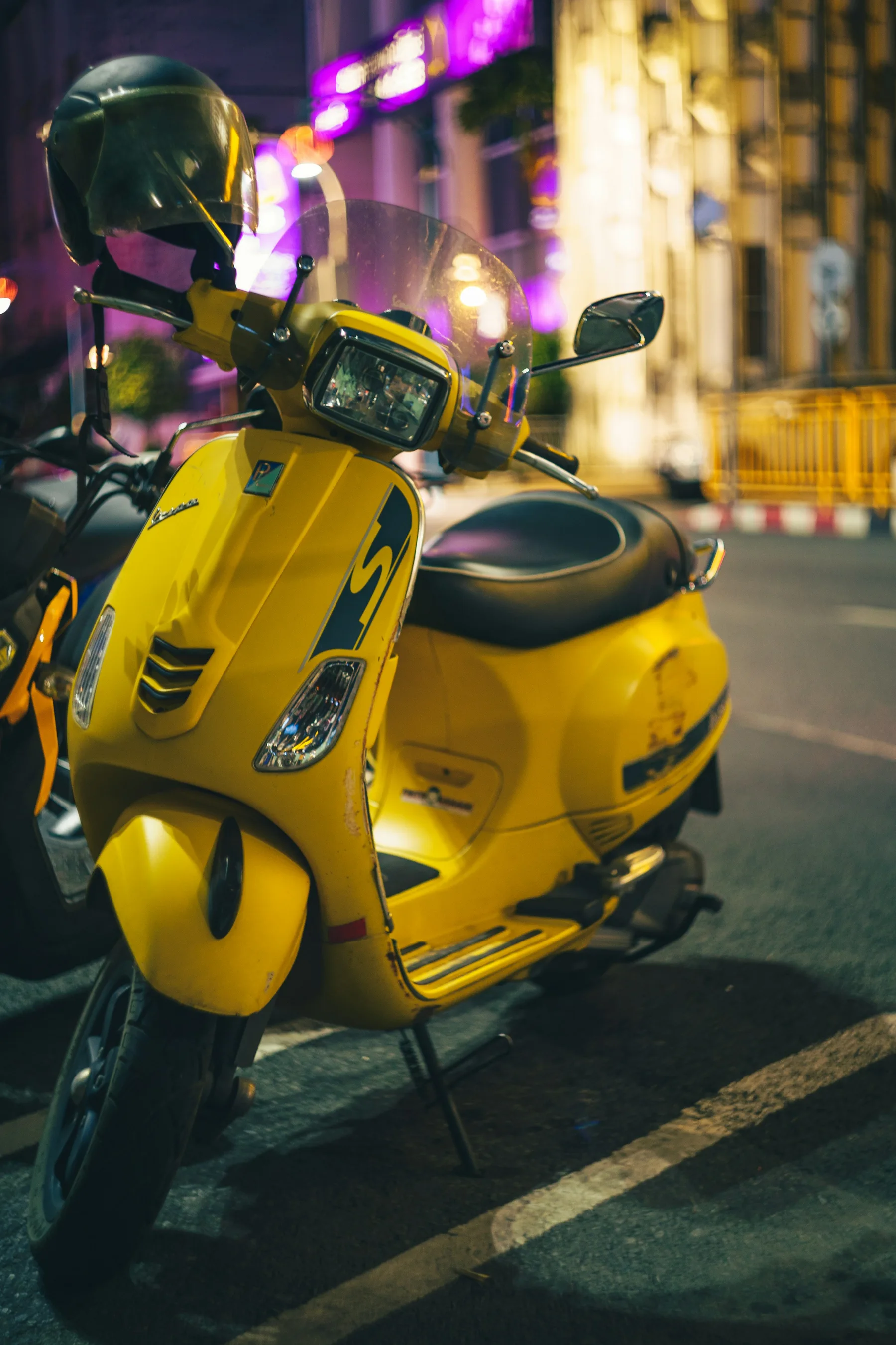 Yellow scooter on a Phuket street; illustrative photograph, not a vehicle offered by this business